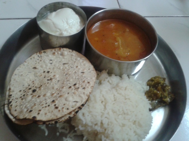 Fresh curd,Pepper Papad roasted,Steamy Hot rice and green chillipickle,with the Puli Kulambu
